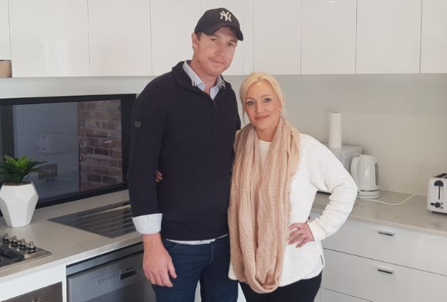 A man and woman in a kitchen