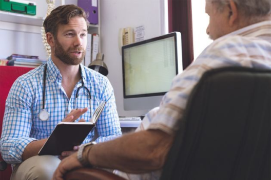 Doctor speaking to patient