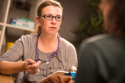 A doctor consults with a patient