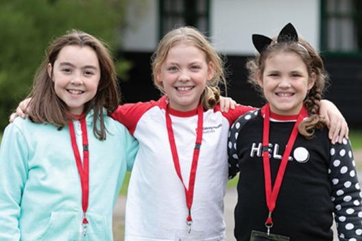 Three young girls pose